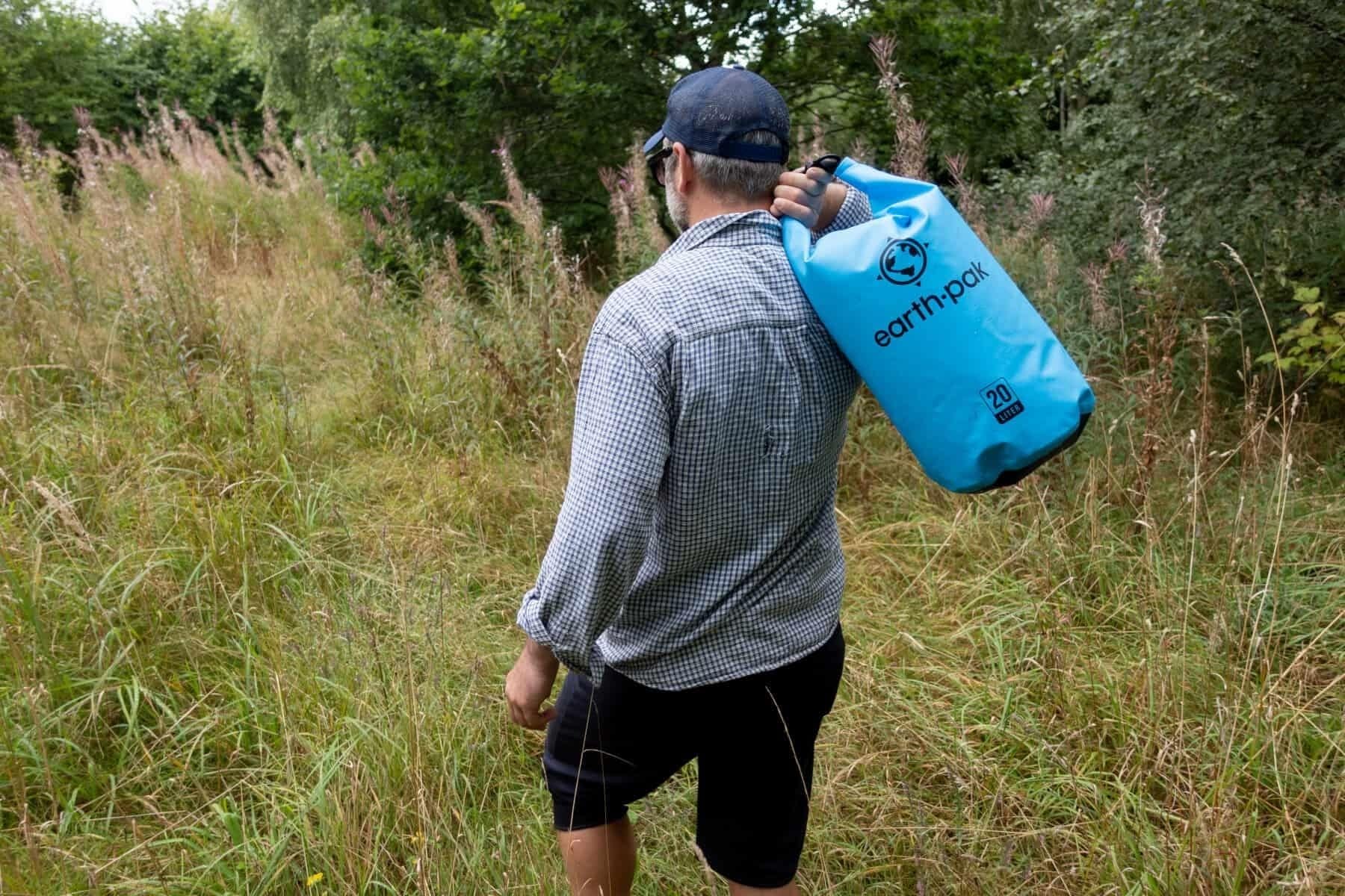 earth-pak-waterproof-held-on-shoulder