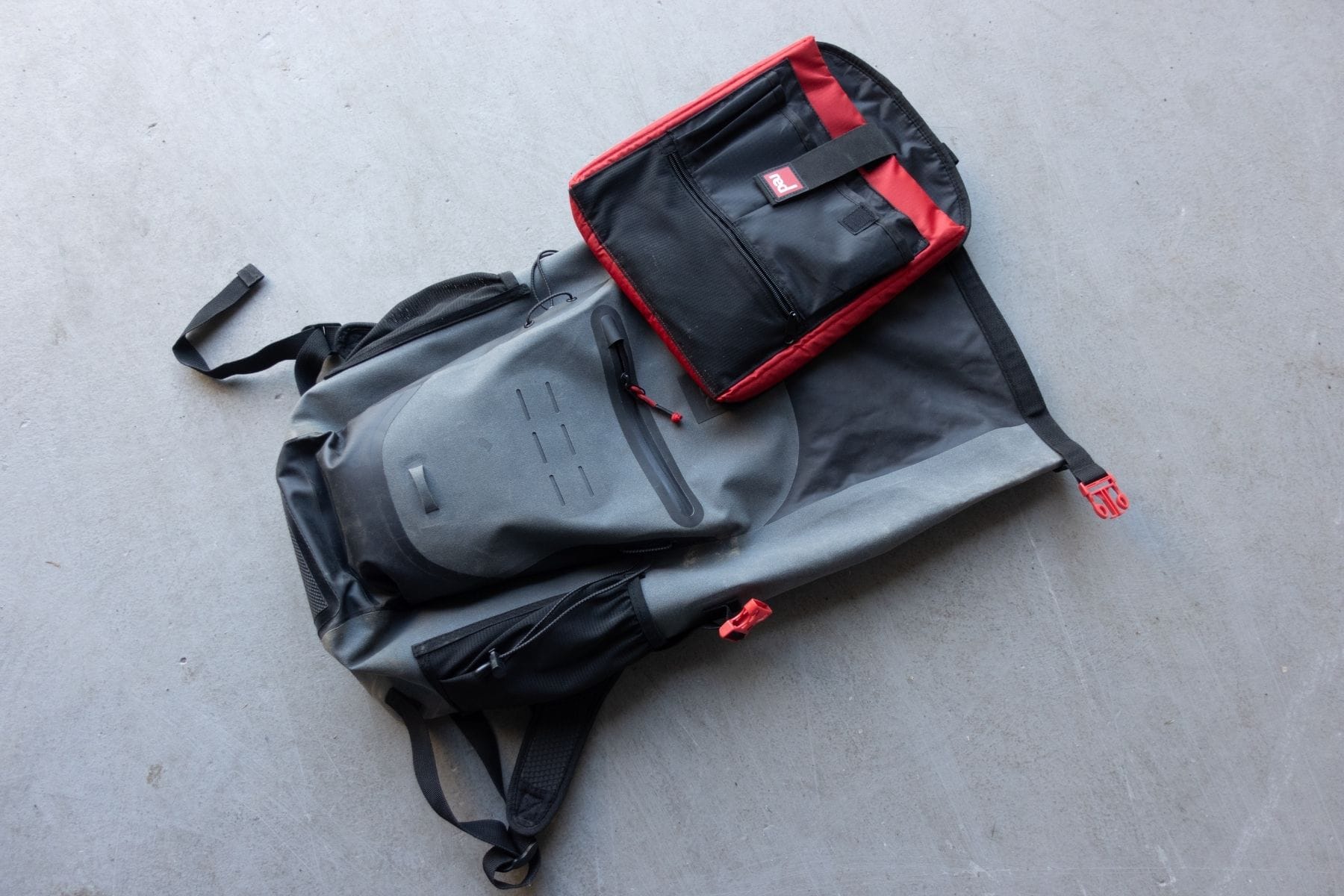 red-eco-friendly-waterproof-30l-flat-lay-with-smaller-bag