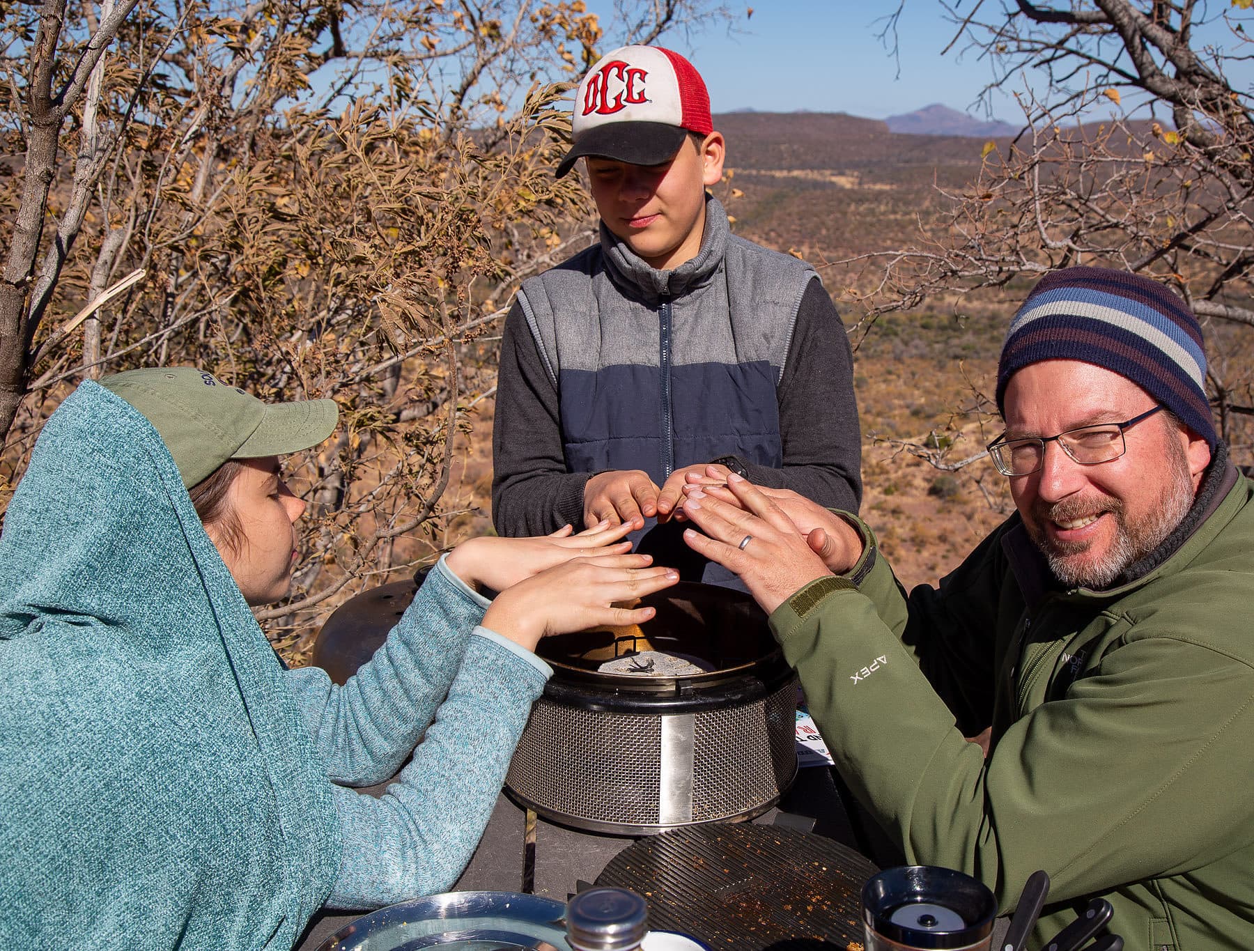 winter-camping-warming-hands