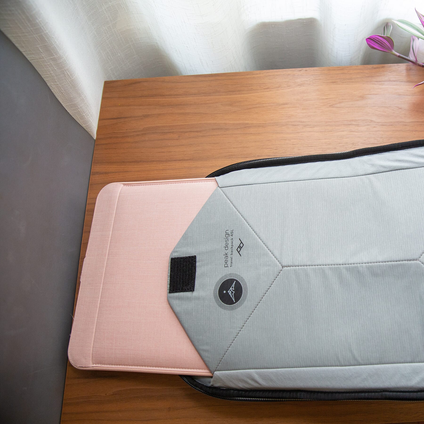 The laptop sleeve is padded and has a velcro hold to keep your laptop secure.